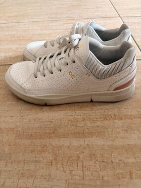 On Running Running Women’s White Leather Sneakers with Pink Accent